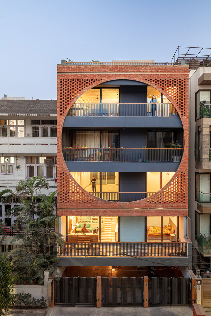 grand circular aperture within square brick screen dominates AKDA's family house in india