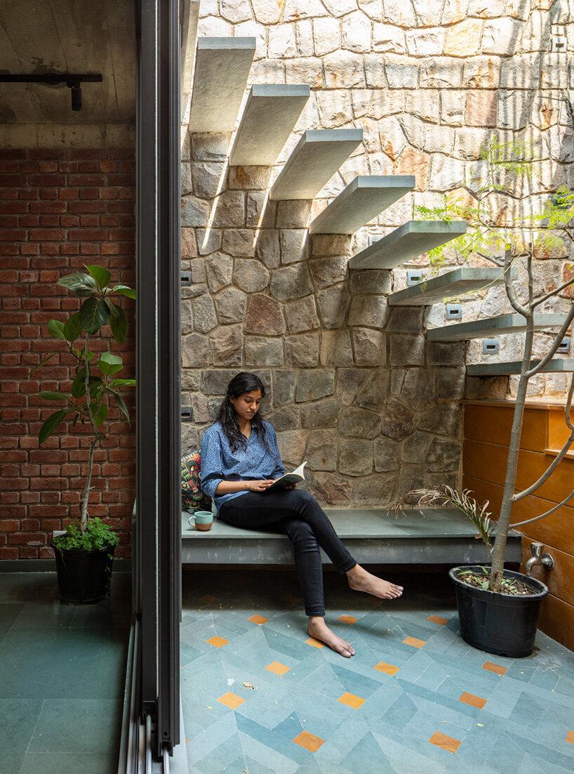 grand circular aperture within square brick screen dominates AKDA's family house in india