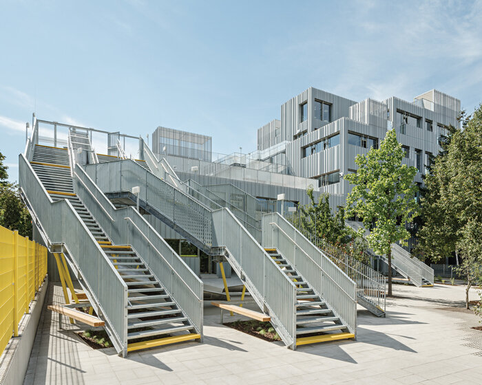 corrugated sheet clads a school extension in vienna by PPAG architects