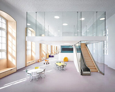 glass-clad mezzanine levels expand renovated nursing school by RMDM in paris