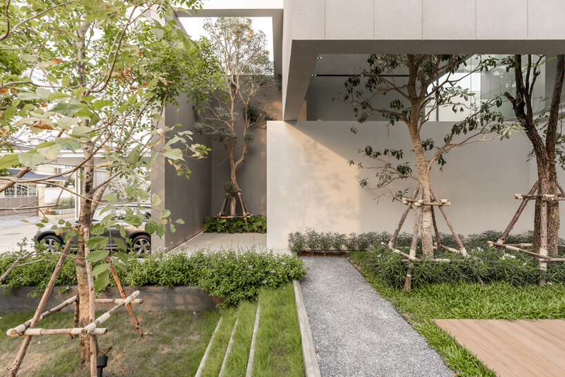 four miniature courtyards bring nature inside this secluded family house in thailand
