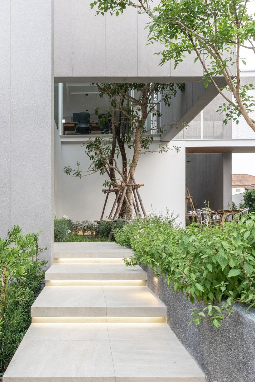 four miniature courtyards bring nature inside this secluded family house in thailand