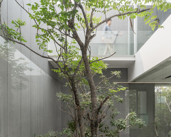 four miniature courtyards bring nature inside this secluded family house in thailand