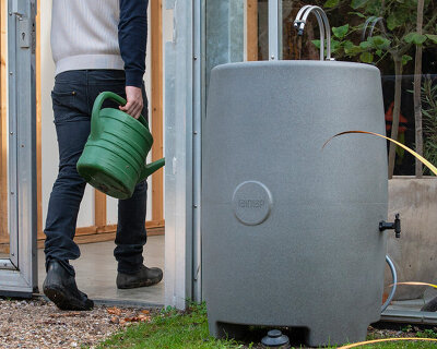 portable water station made of recycled plastic harvests + stores rainwater for everyday use
