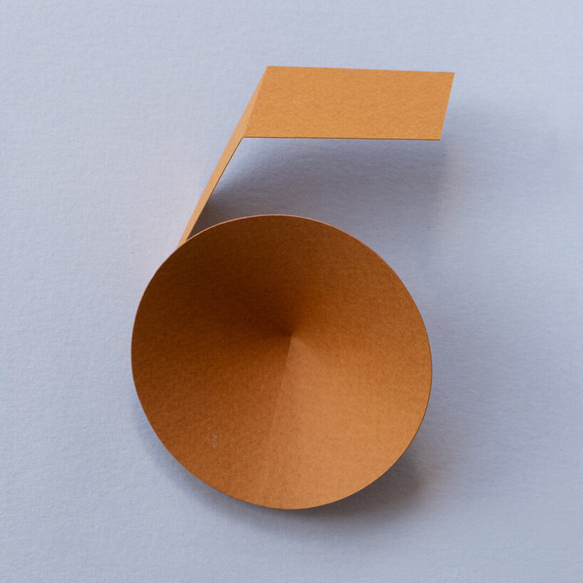 reina takahashi folds and twists paper strips to form calligraphic character series