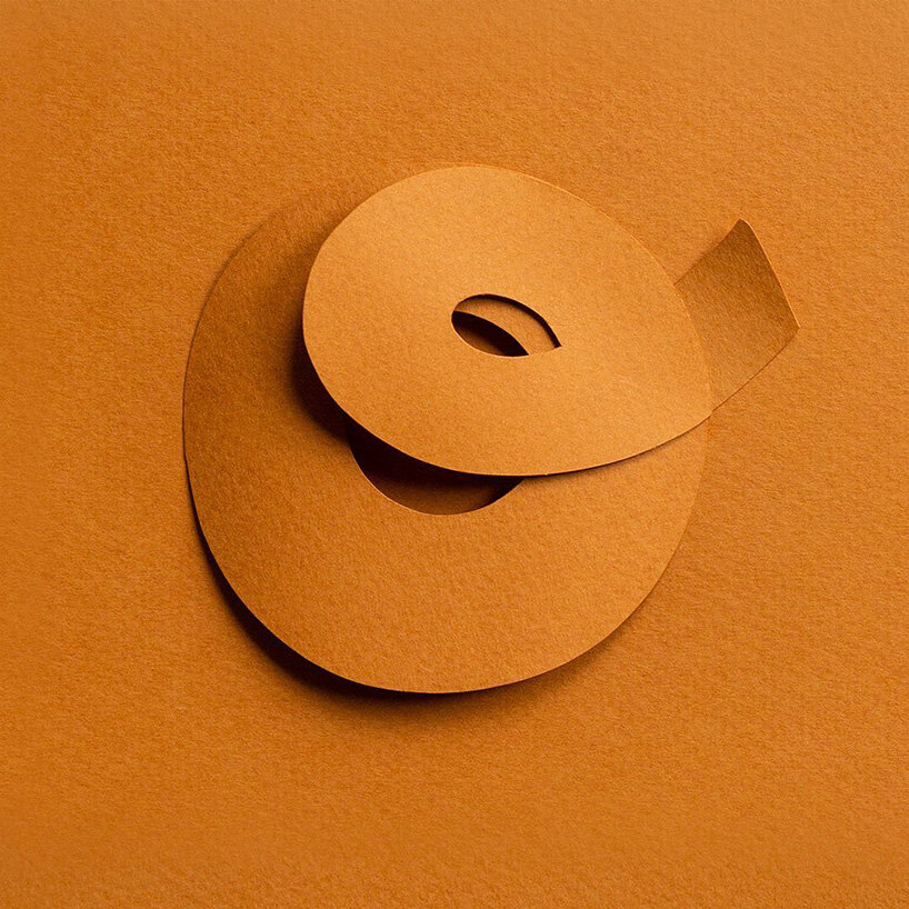 reina takahashi folds and twists paper strips to form calligraphic character series