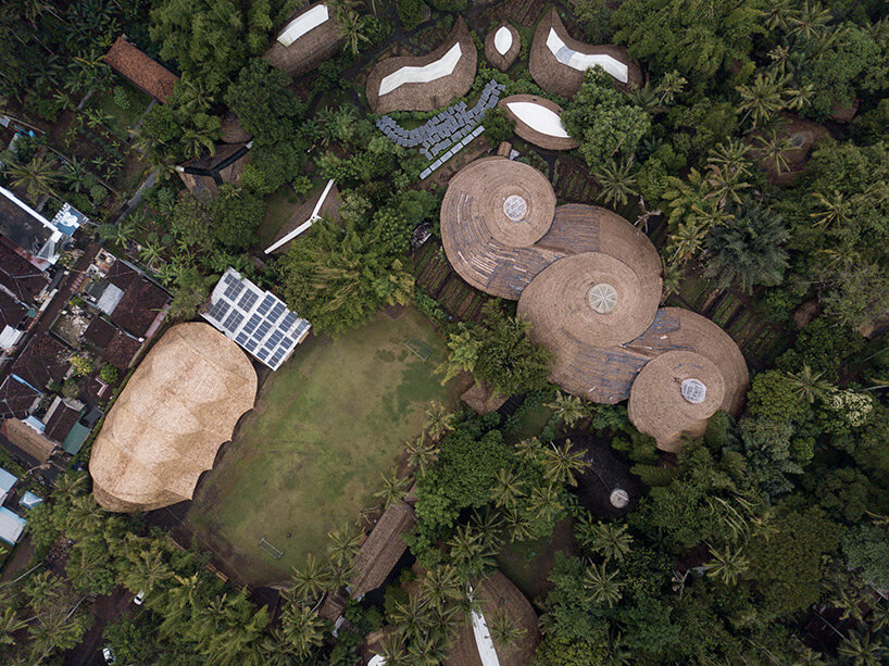 draping roof tops lightweight bamboo structure by IBUKU for green school in bali, indonesia