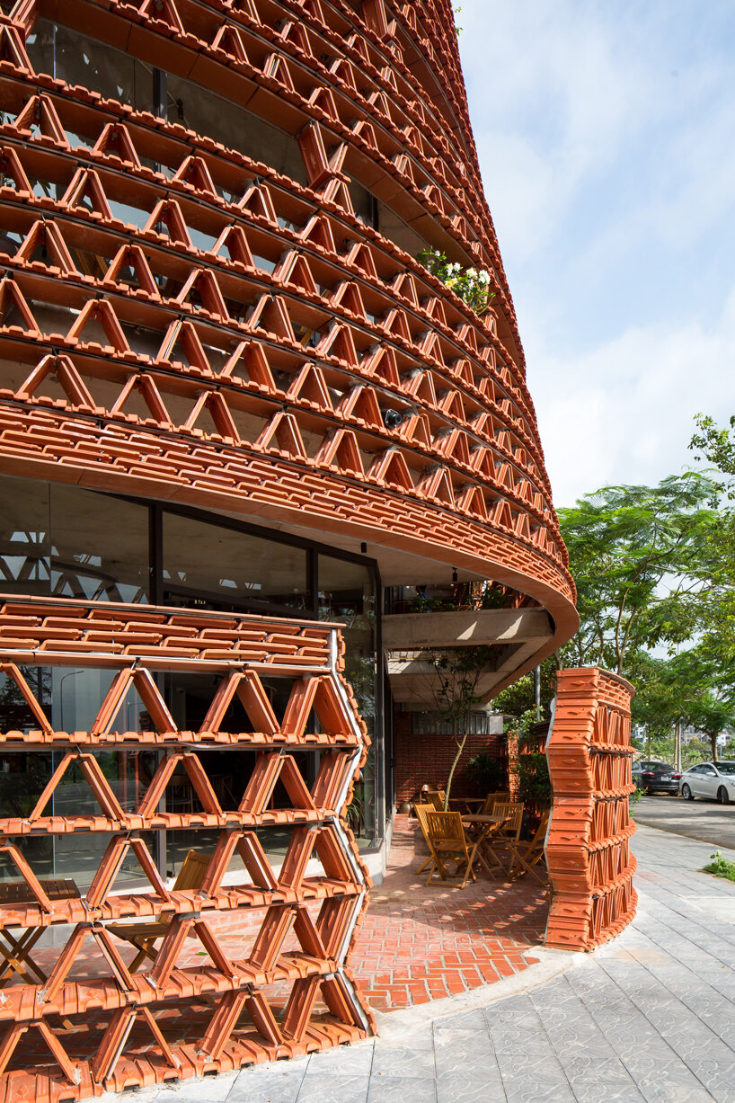 H&P architects wraps 20,000 tiles around 'ngói space' in hanoi, vietnam designboom