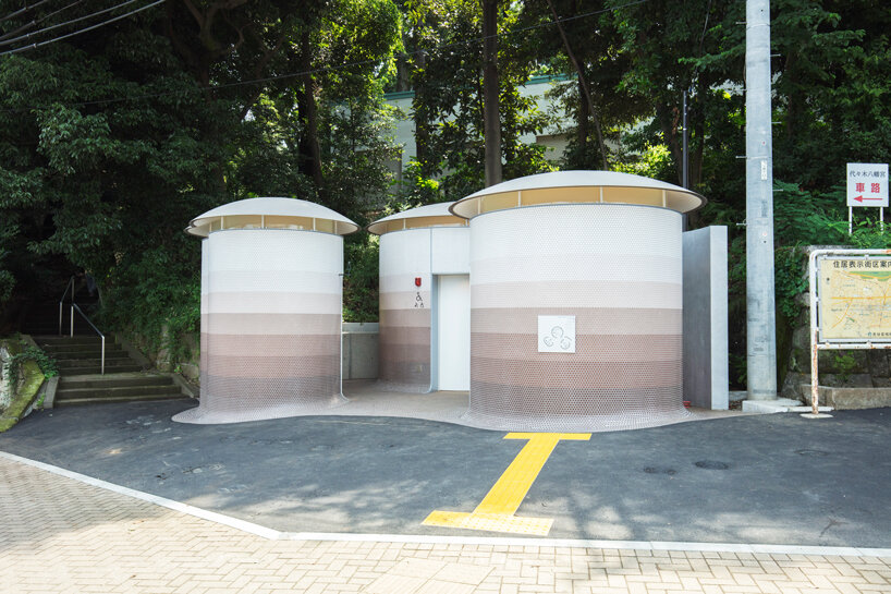 toyo ito's tokyo toilet appears like three mushrooms sprouted in the woods designboom