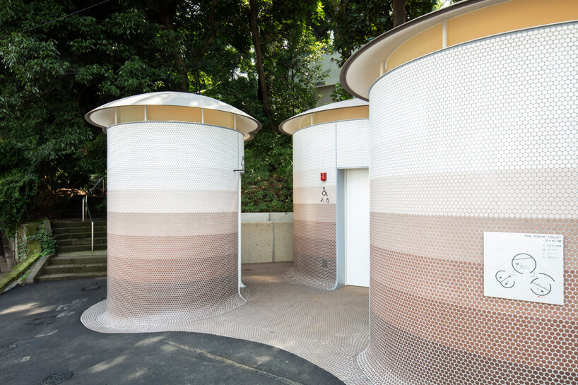 toyo ito's tokyo toilet appears like three mushrooms sprouted in the woods designboom