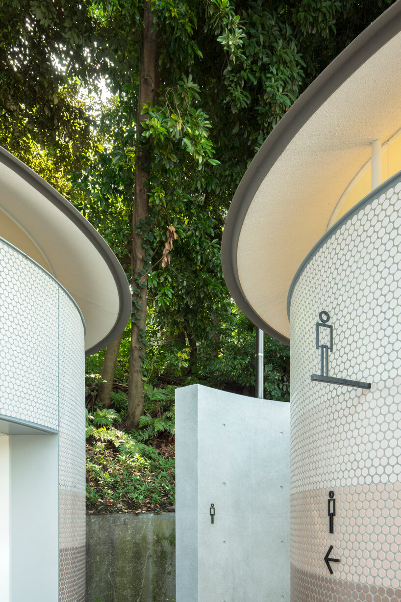 toyo ito's tokyo toilet appears like three mushrooms sprouted in the woods designboom
