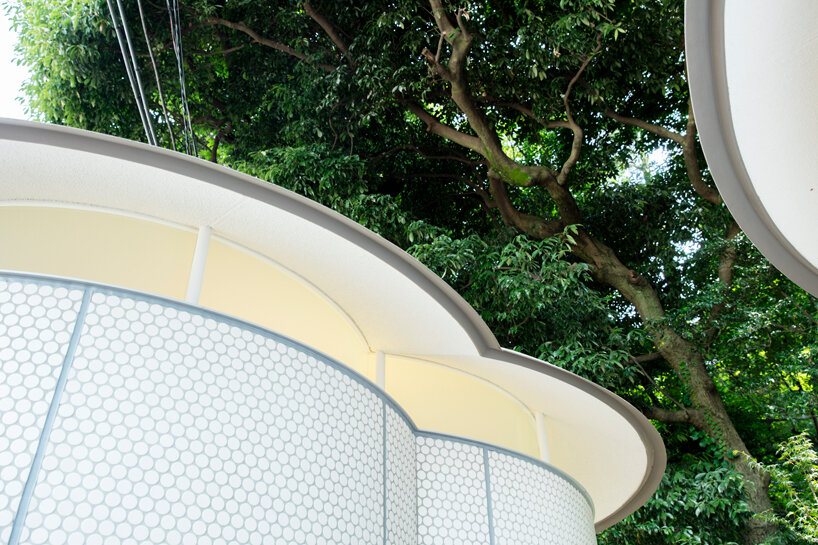 toyo ito's tokyo toilet appears like three mushrooms sprouted in the woods designboom