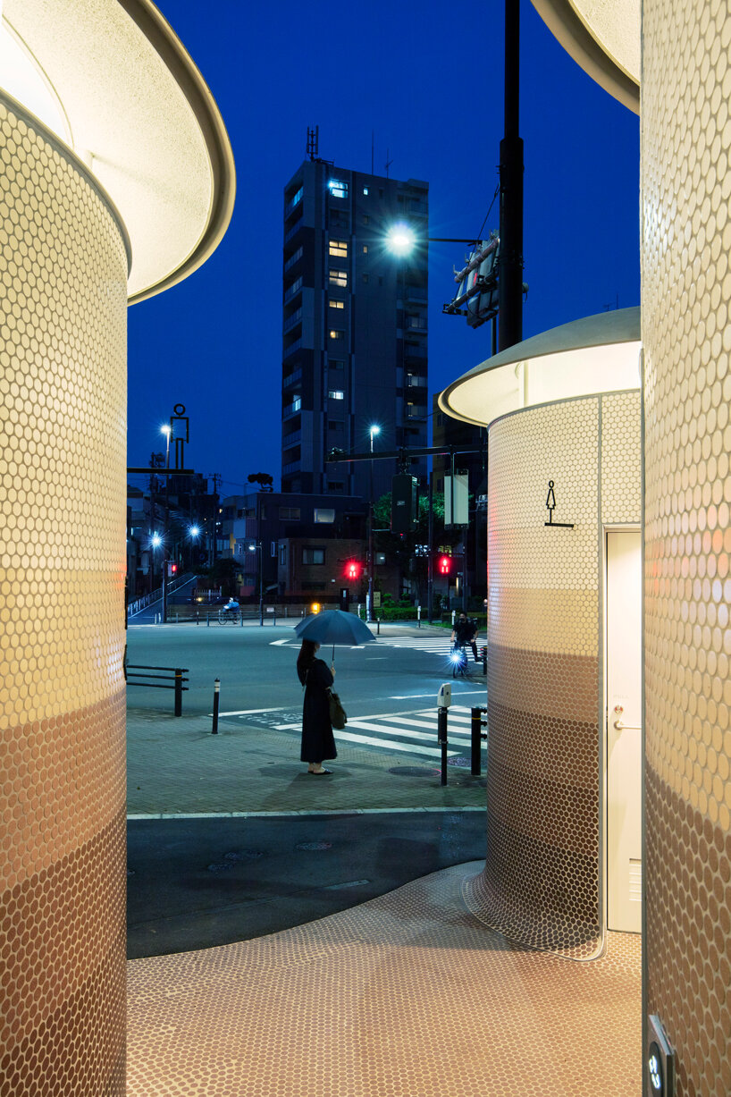 toyo ito's tokyo toilet appears like three mushrooms sprouted in the woods designboom