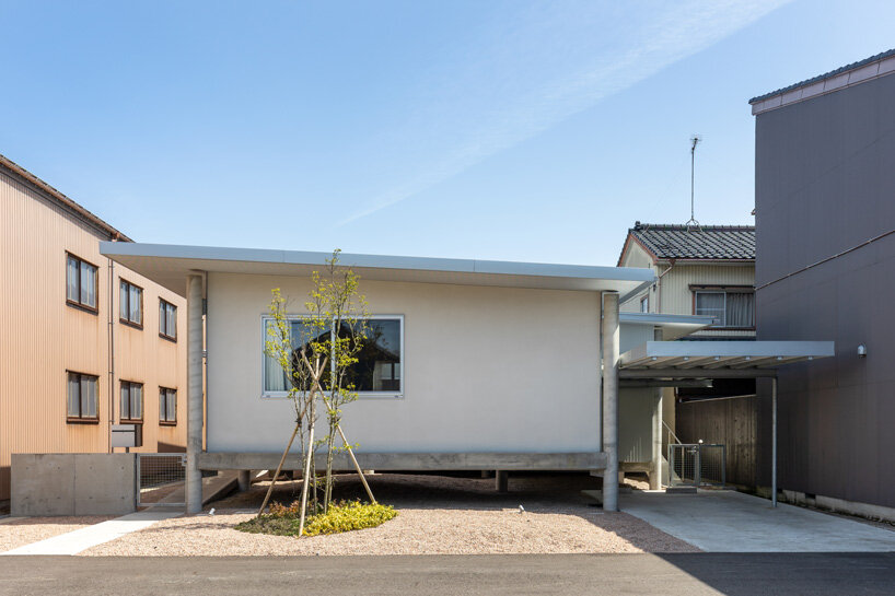 UNEMORI ARCHITECTS elevates flood-proof house on stilts in takaoka, japan