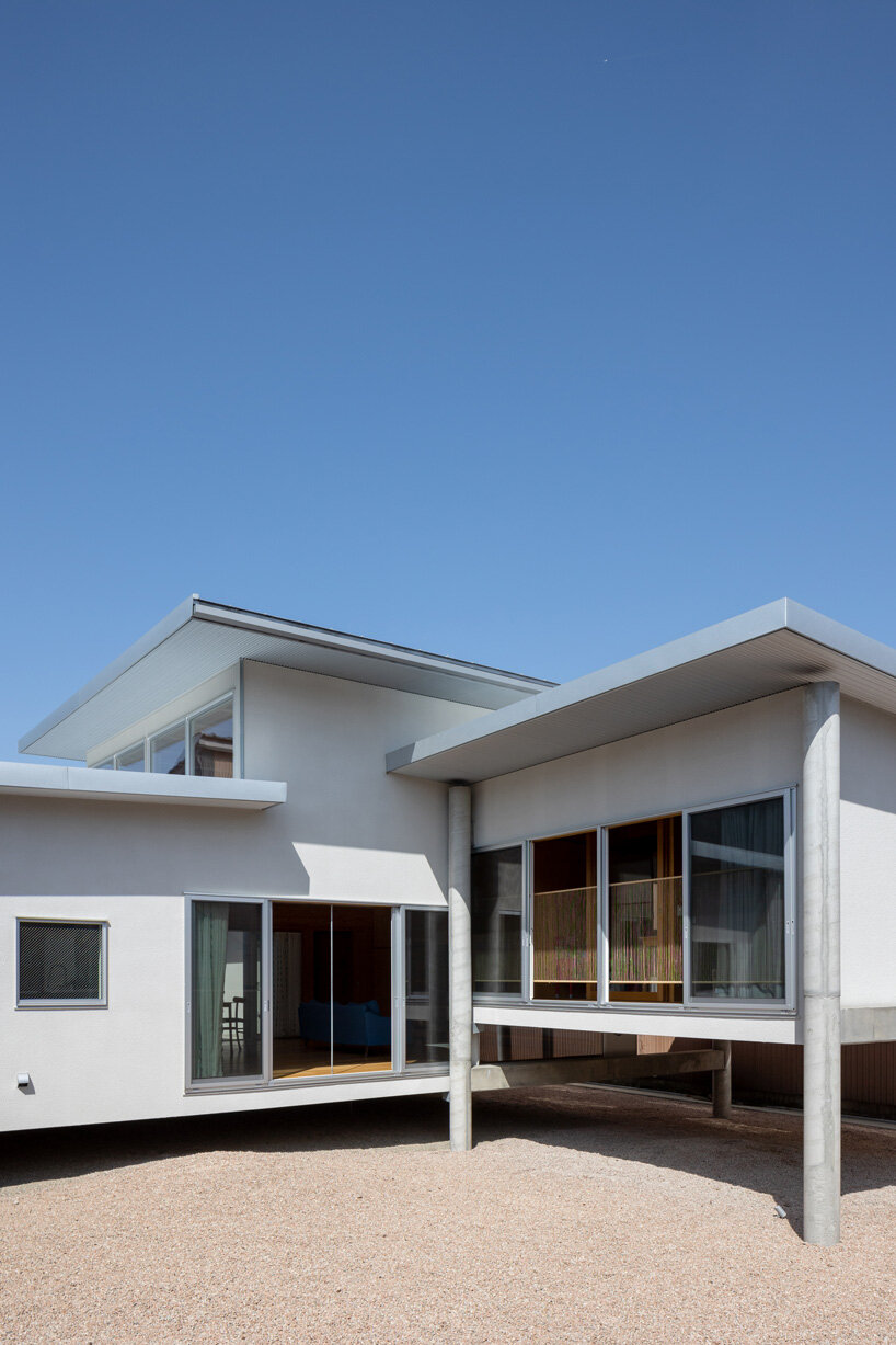 UNEMORI ARCHITECTS elevates flood-proof house on stilts in takaoka, japan