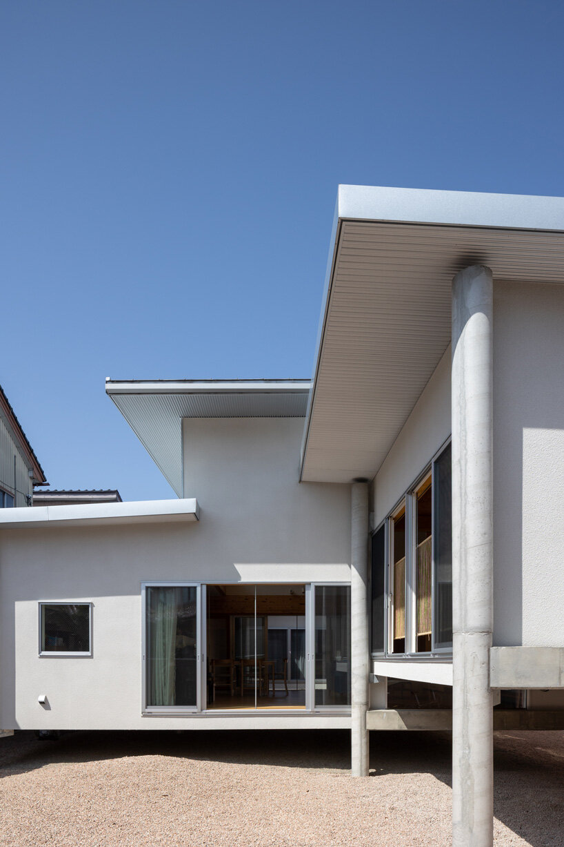 UNEMORI ARCHITECTS elevates flood-proof house on stilts in takaoka, japan