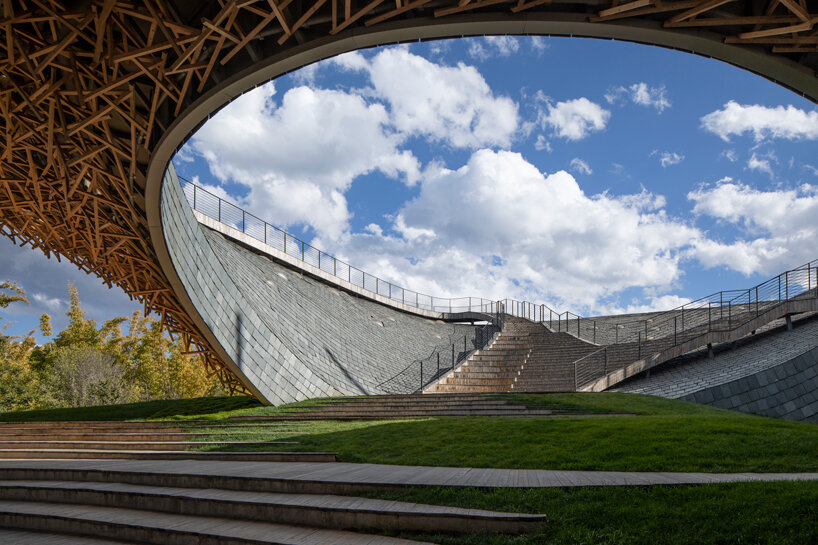 yangliping performing arts center by studio zhu pei is cantilevered on chinese mountain