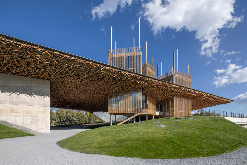 yangliping performing arts center by studio zhu pei is cantilevered on chinese mountain