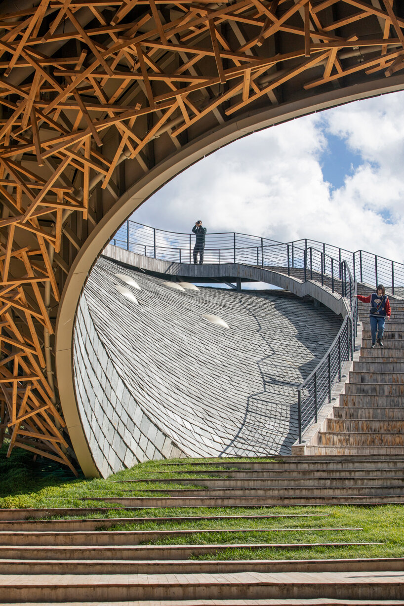 yangliping performing arts center by studio zhu pei is cantilevered on chinese mountain