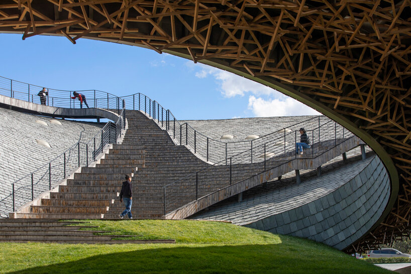 yangliping performing arts center by studio zhu pei is cantilevered on chinese mountain