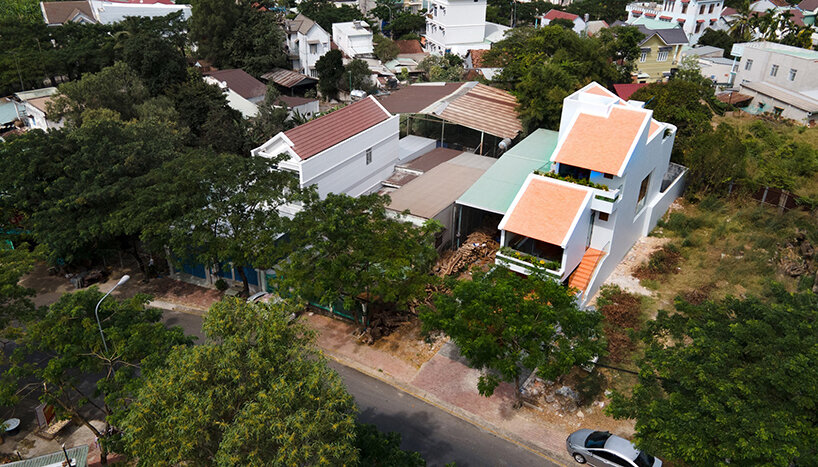 serpentine pink staircase highlights the inclination of AD+studio's house in vietnam