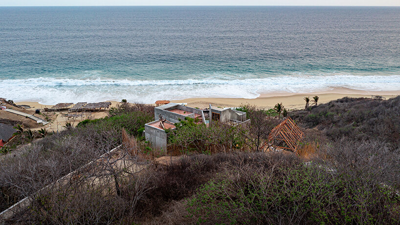 two rotated concrete volumes look for sunrise and sunset in mexican 'casa del sapo'