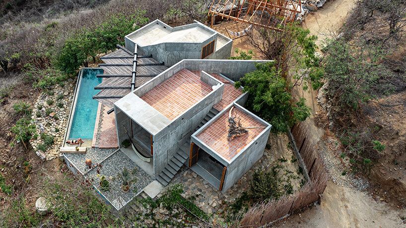 two rotated concrete volumes look for sunrise and sunset in mexican 'casa del sapo'