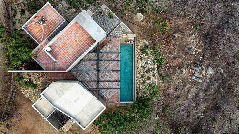 two rotated concrete volumes look for sunrise and sunset in mexican 'casa del sapo'