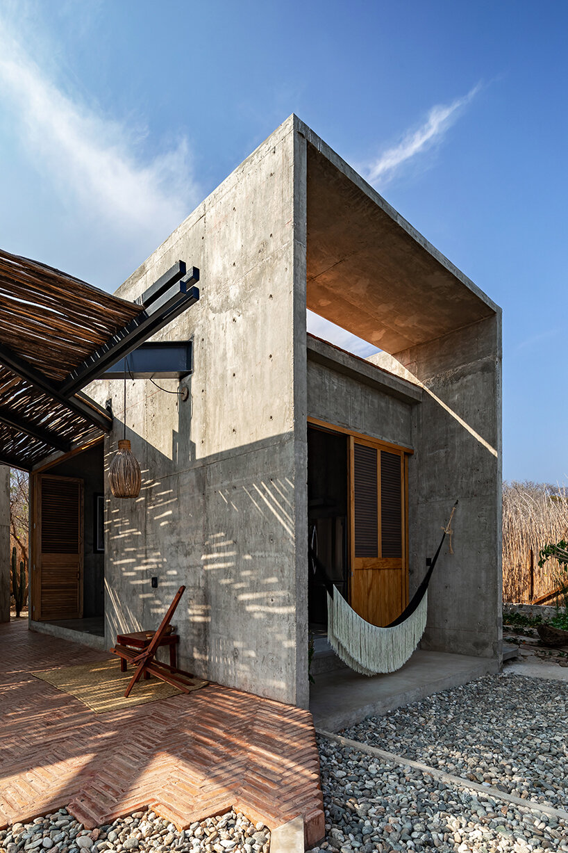 two rotated concrete volumes look for sunrise and sunset in mexican 'casa del sapo'