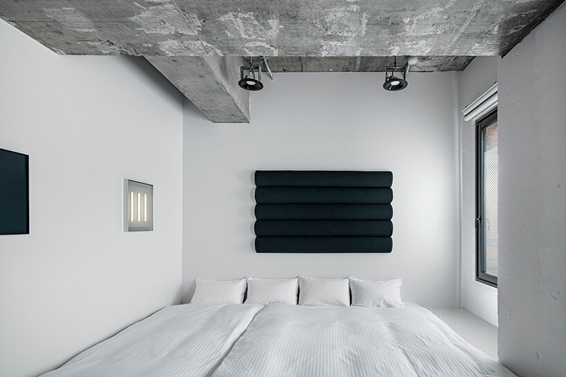 DDAA's 'framed function' room in tokyo is a blank cube canvas displaying abstract objects