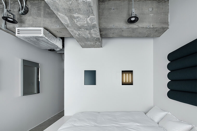 DDAA's 'framed function' room in tokyo is a blank cube canvas displaying abstract objects