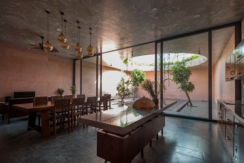 large circular roof opening punctures 23o5 studio's pink house in vietnam