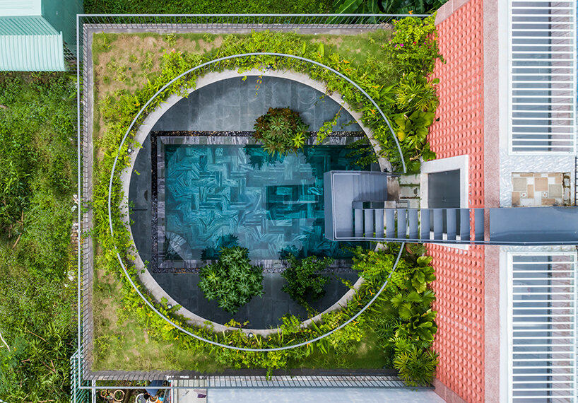 large circular roof opening punctures 23o5 studio's pink house in vietnam