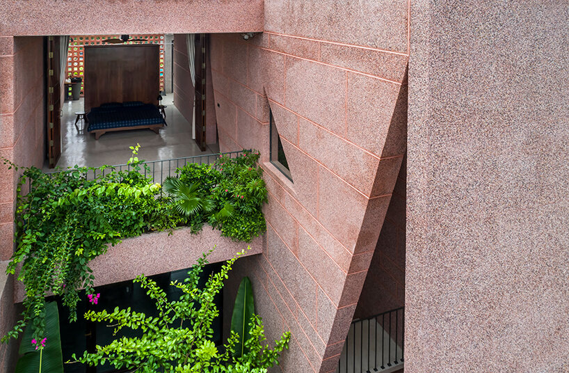 large circular roof opening punctures 23o5 studio's pink house in vietnam