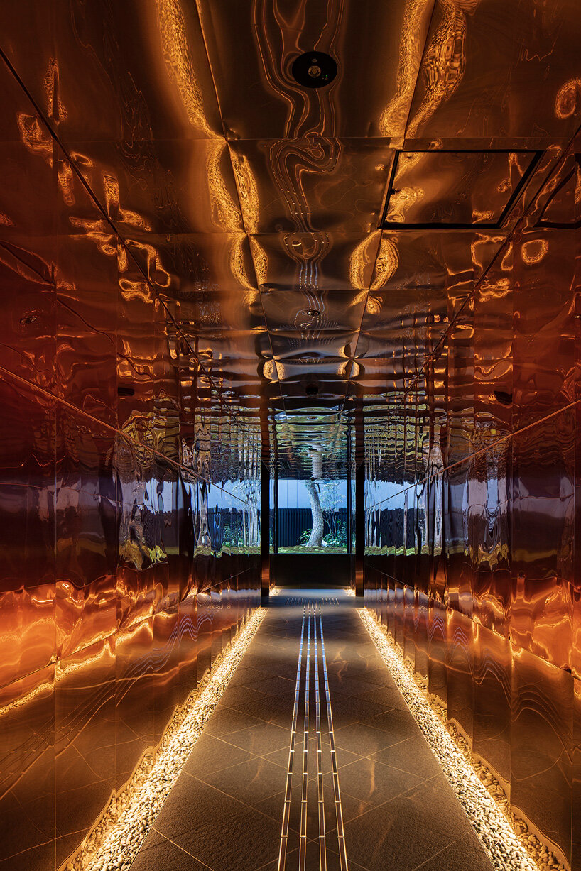 narrow copper box leads guests inside tranquil kyoto hotel by suppose design office