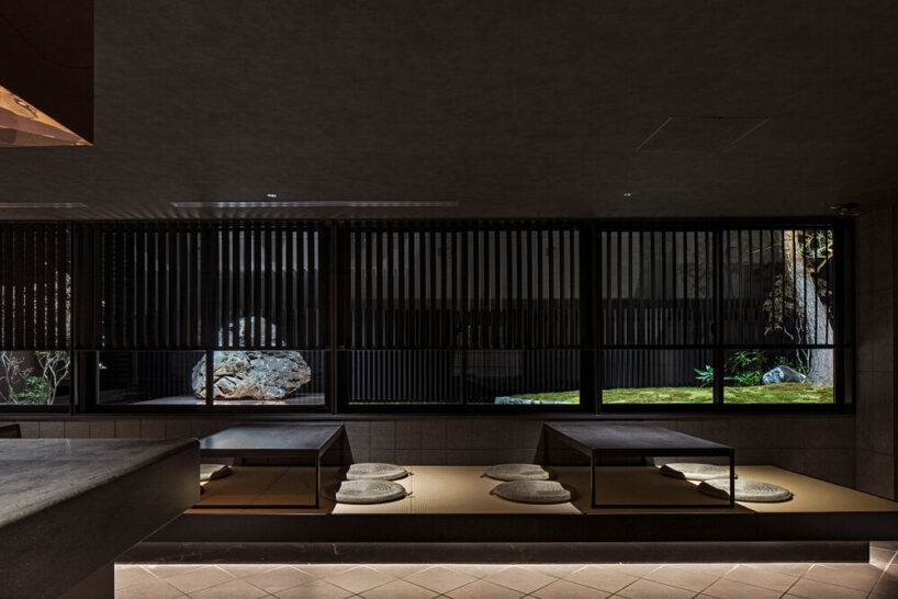 windows bring in views of the courtyard garden