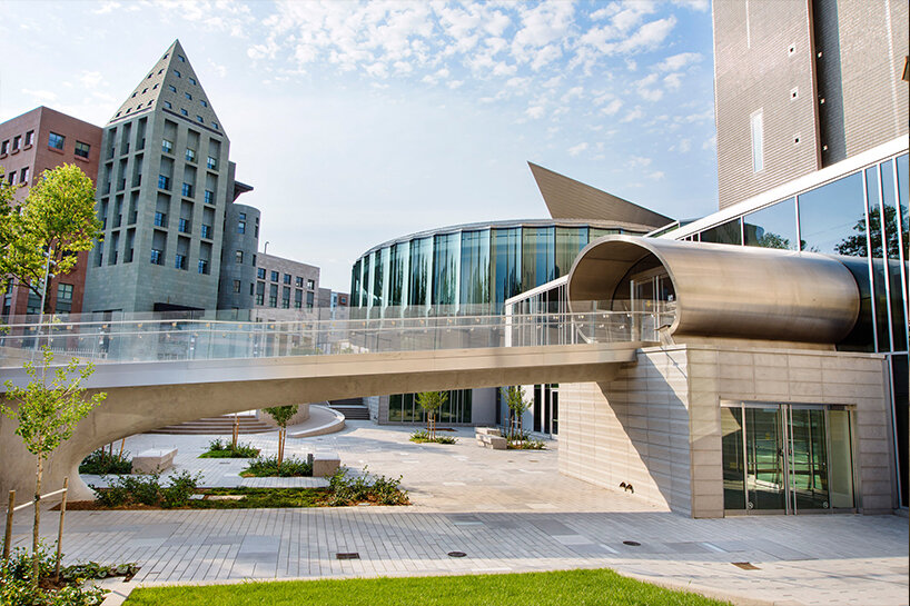 round glazed façade welcomes visitors at denver art museum's transformation