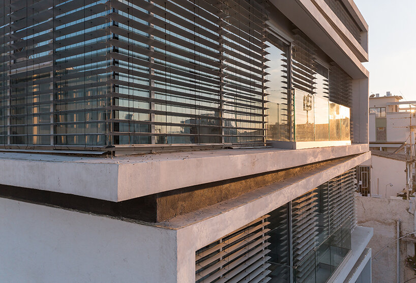 ink hotel emerges as a pile of stacked books in the heart of tel aviv, israel