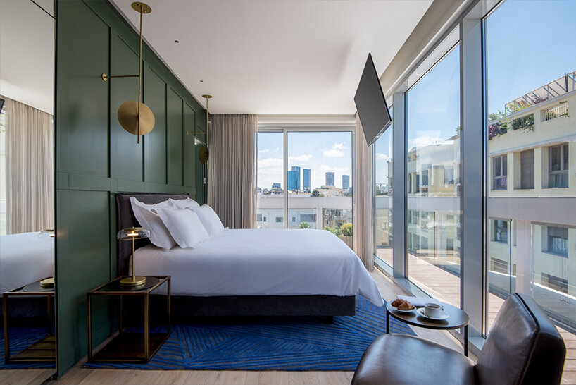 ink hotel emerges as a pile of stacked books in the heart of tel aviv, israel - 3