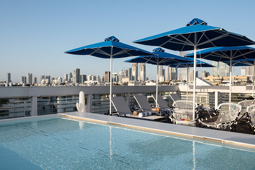 ink hotel emerges as a pile of stacked books in the heart of tel aviv, israel - 4