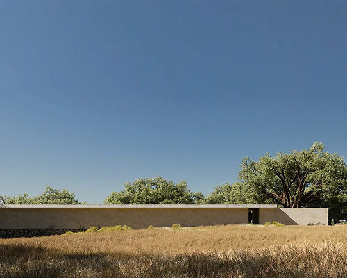 abandoned agricultural construction turns into earthy minimalist residence in rural portugal