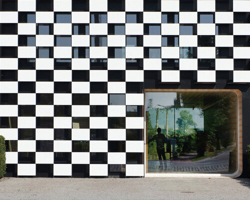 checkered office building in belgium is designed to 'stand out from the crowd'