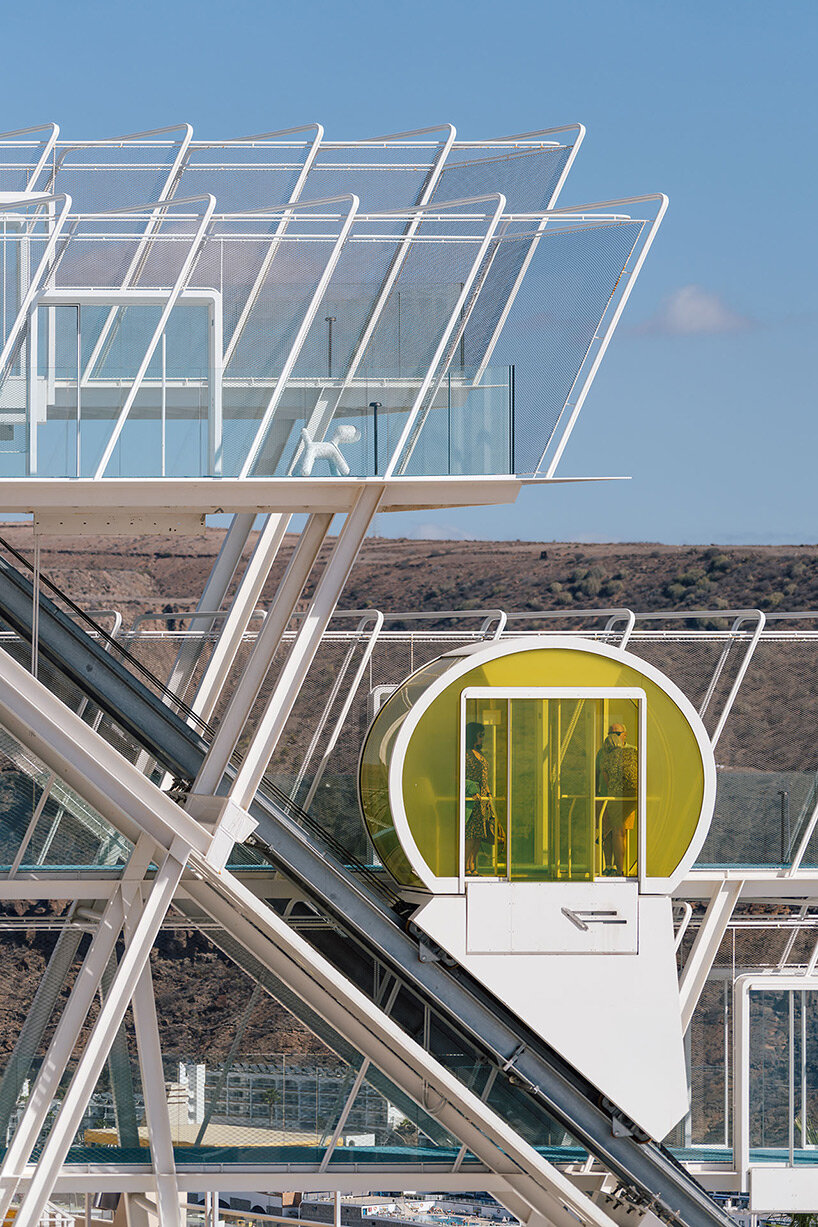 lopezneiraciaurri architecture installs bright yellow funicular on neglected 70s hotel in gran canaria