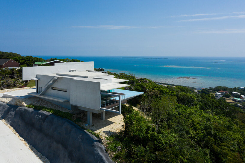 concrete hilltop villa by kidosaki architects studio overlooks the pacific ocean in japan