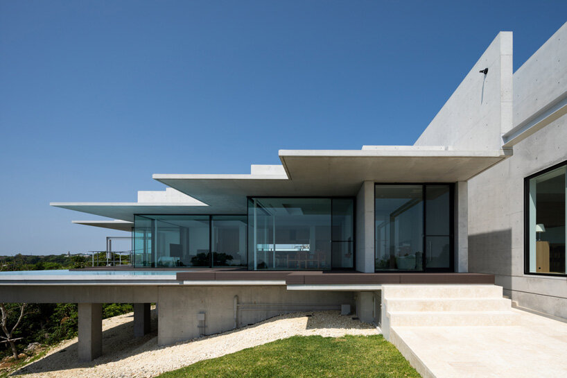 concrete hilltop villa by kidosaki architects studio overlooks the pacific ocean in japan