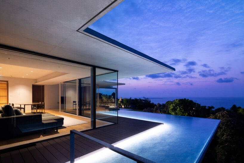 the swimming pool serves as a visual extension of the surrounding scenery