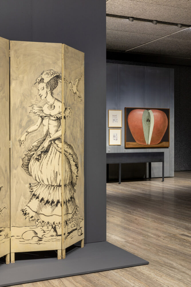 in the foreground: senza titolo (paravento), 1949 circa; in the background, on the wall, from left to right: sketches for open drawer, s’estaca, mallorca, 22 september 1968 | sketch of the palace of culture and science, warsaw, february 1968 | apple, 1968