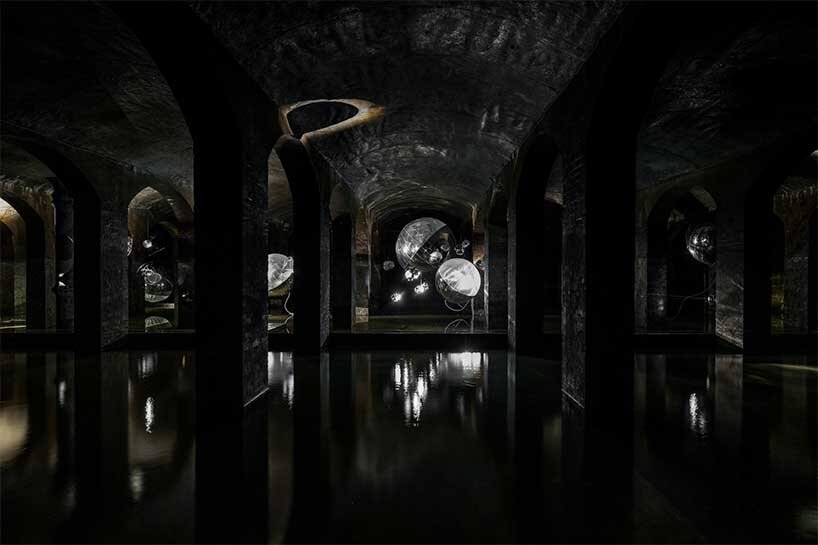 luminous spheres hover within tomás saraceno's floating exhibition in cisternerne