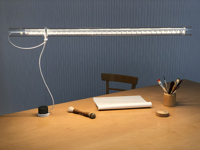 ingo maurer unveils pendant light and table lamp hybrid 'tubular balance' 