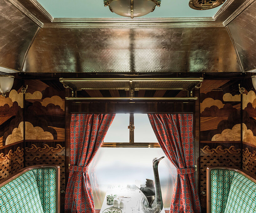 wes anderson revives 1950s train carriage inviting visitors into whimsical film sets